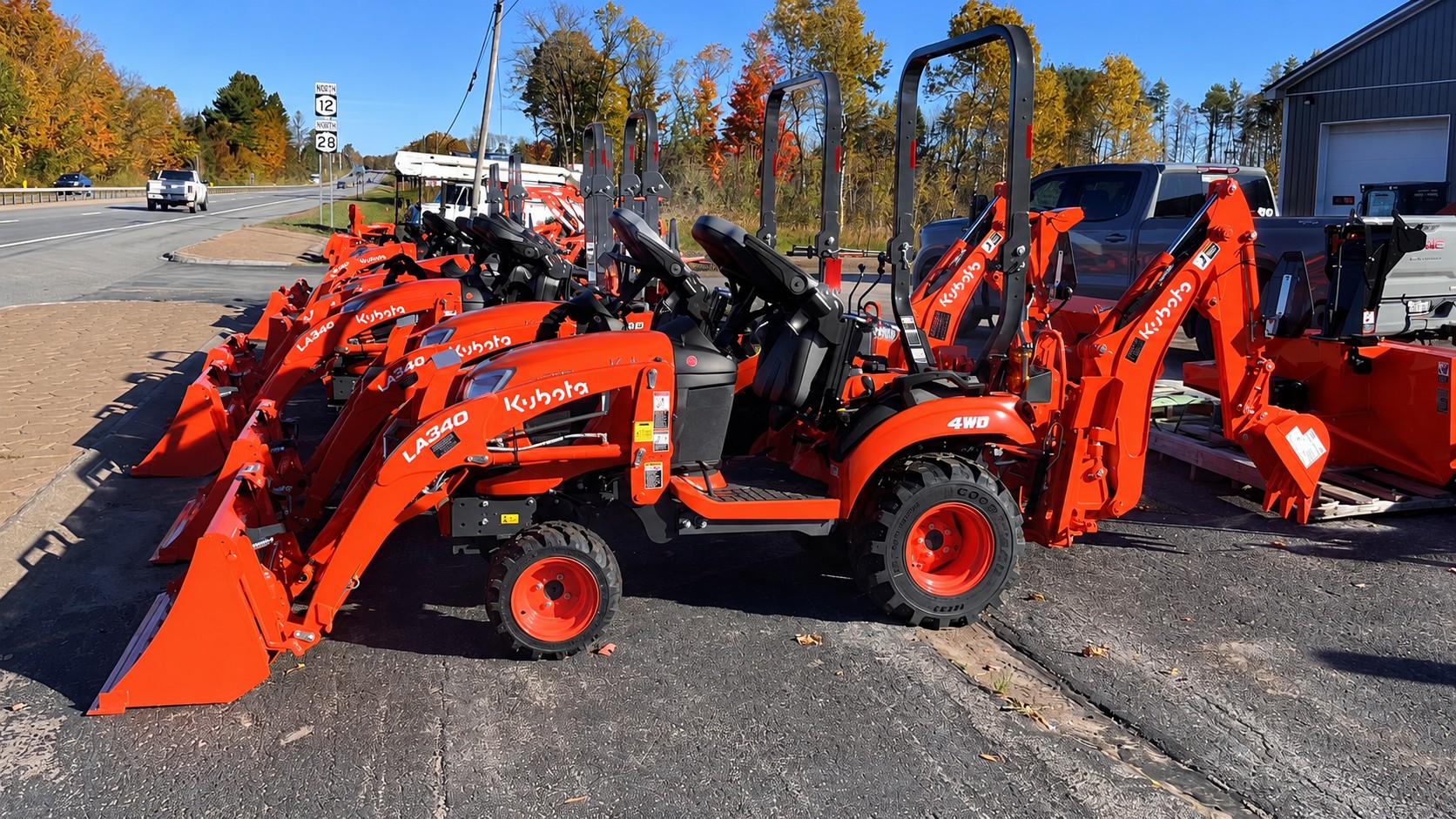 Kubota tractor with front loader and backhoe at Evans Equipment